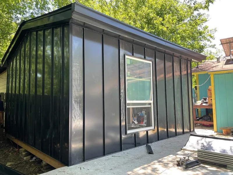 Black standing seam metal wall panels for Roof Inspection in Del City